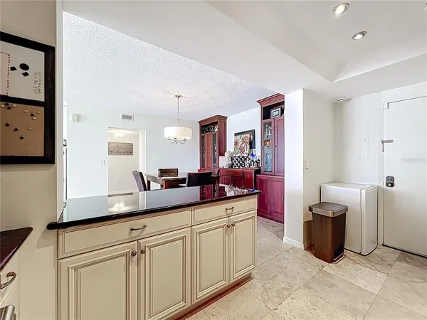 a kitchen with stainless steel appliances a sink and a refrigerator