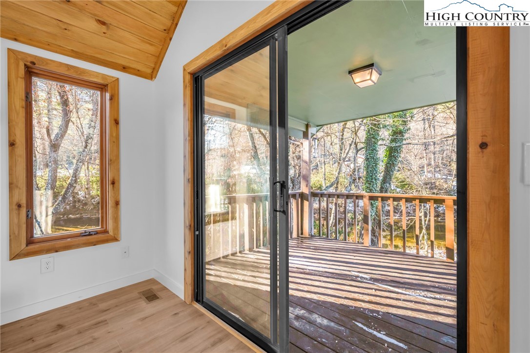 208 Meadow Loop Newland, NC 28657 - Photo 11 of 46 a view of a room that has a large window