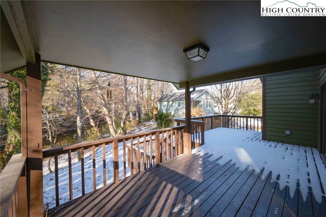 208 Meadow Loop Newland, NC 28657 - Photo 28 of 46 a view of a porch with wooden floor