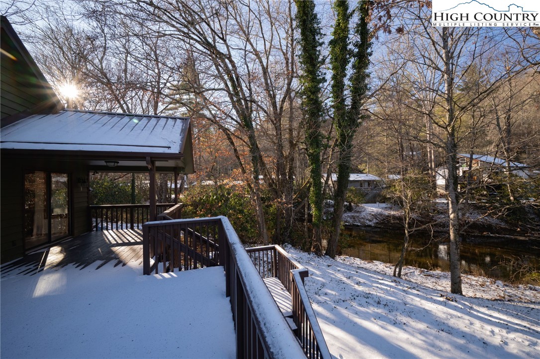 208 Meadow Loop Newland, NC 28657 - Photo 36 of 46 a patio with glass top table and chairs
