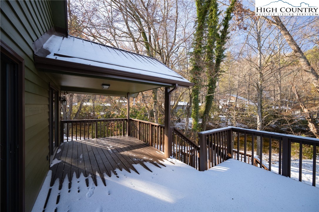 208 Meadow Loop Newland, NC 28657 - Photo 37 of 46 a view of a roof deck with wooden floor and fence