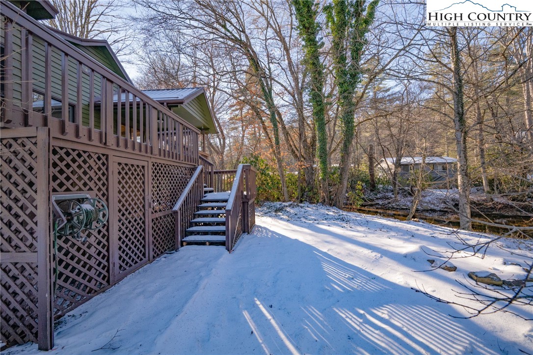 208 Meadow Loop Newland, NC 28657 - Photo 46 of 46 a view of a house with backyard and wooden