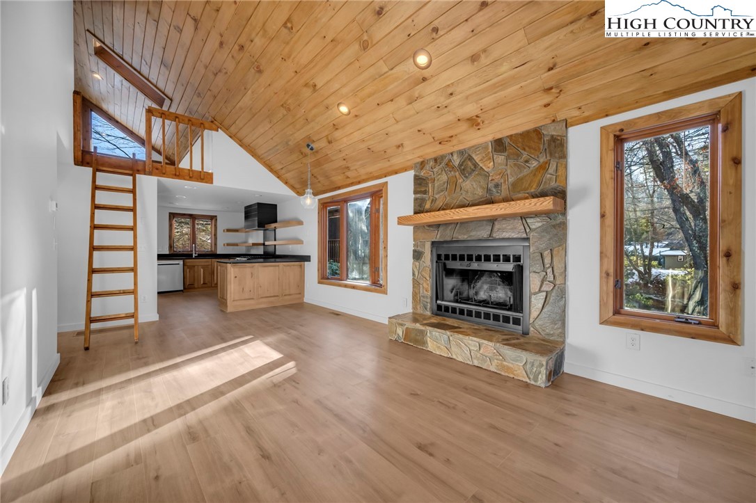 208 Meadow Loop Newland, NC 28657 - Photo 8 of 46 a living room with furniture and a fireplace