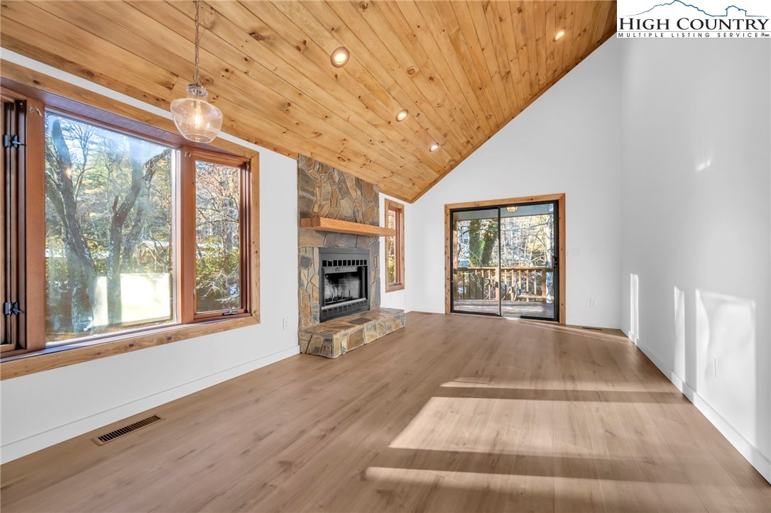 208 Meadow Loop Newland, NC 28657 - Photo 10 of 46 a view of an empty room with a window and fire place