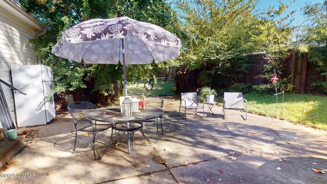 a living room with furniture potted plant and a window