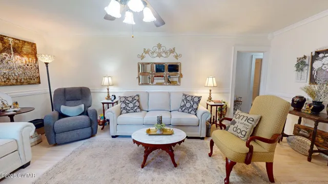 a living room with furniture fireplace and a flat screen tv