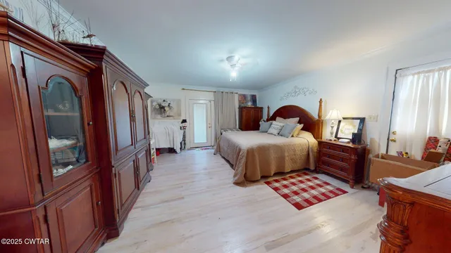 a bed room with a bed and a television