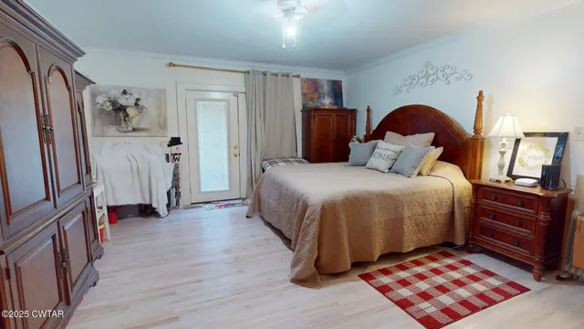 a bedroom with a bed and a dresser