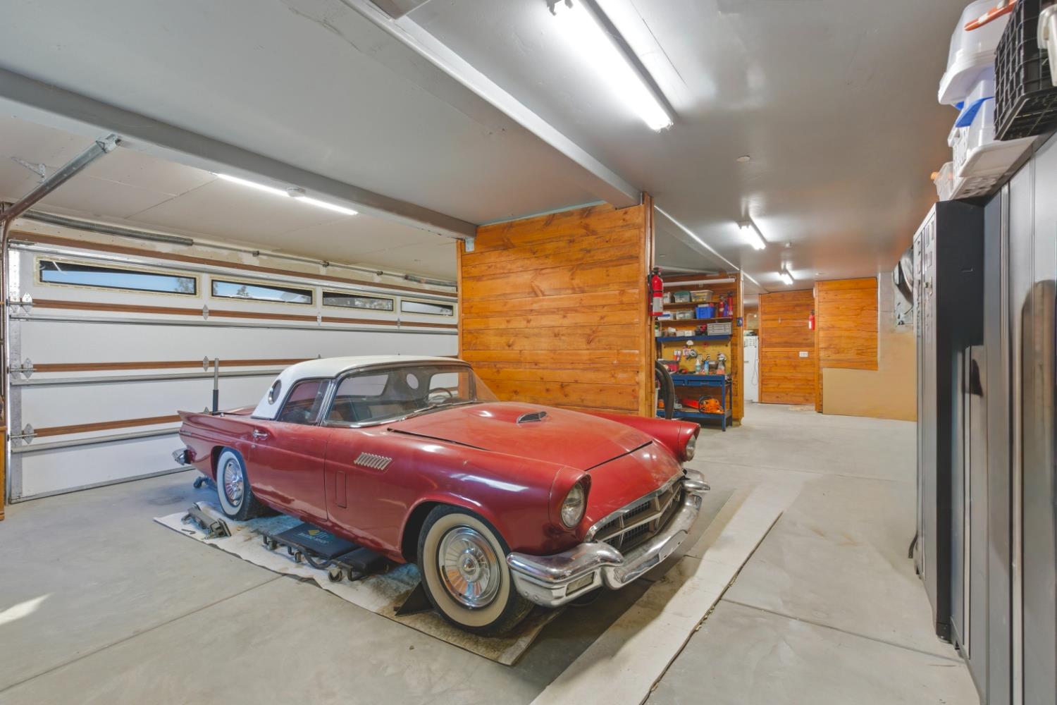 12767 Newtown Road Nevada City, CA 95959 - Photo 22 of 57 a car is parked in a room next to a window
