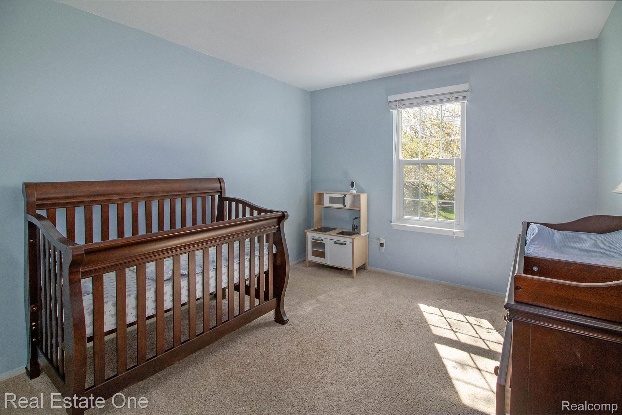 1296 Barneswood Lane Rochester, MI 48306 - Photo 18 of 32 One of the two bedrooms facing the front of the house, currently used as a nursery