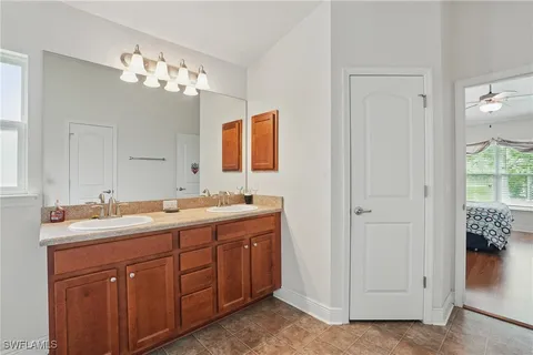 a spacious bathroom with a double vanity sink mirror and