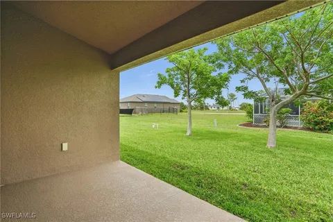 a view of a backyard with a small cabin