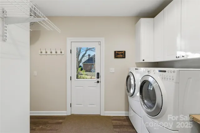 a spacious bedroom with a bed and a chandelier