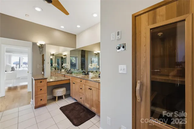 a bathroom with a tub a sink and mirrors