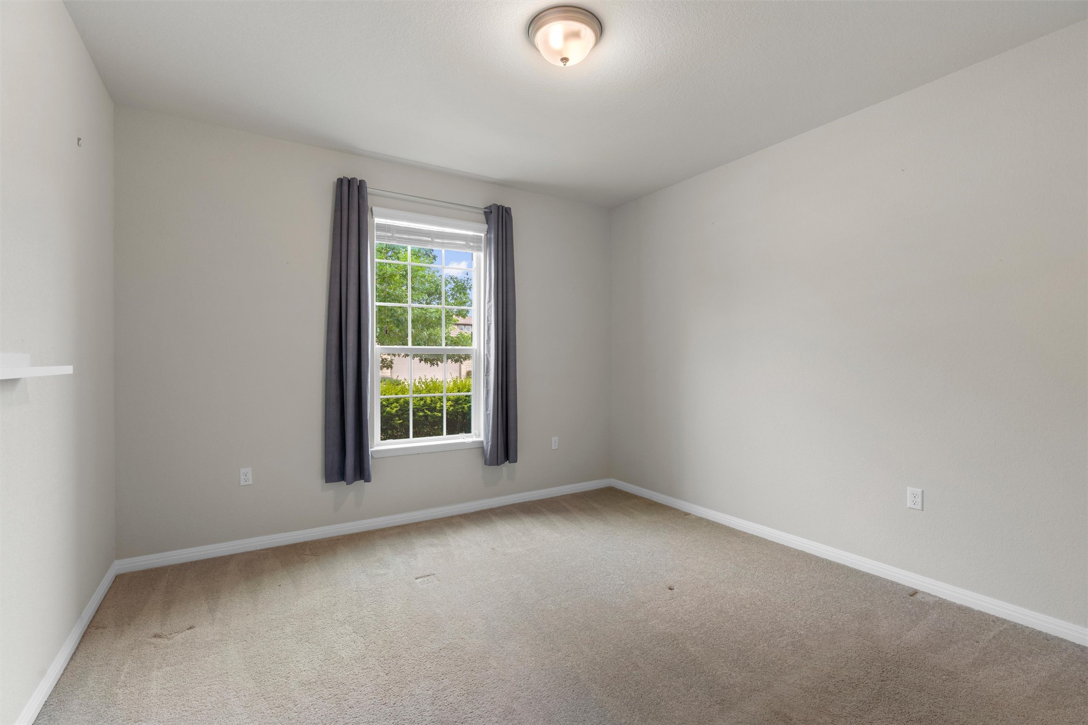 108 Calhoun Lane Georgetown, TX 78633 - Photo 22 of 32 an empty room with a window