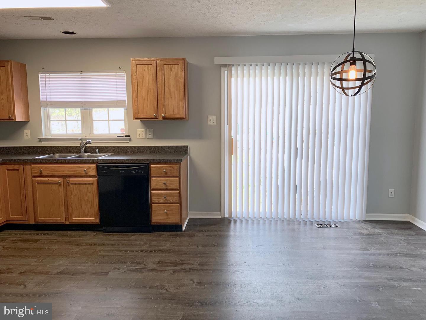 3004 Raking Leaf Drive Abingdon, MD 21009 - Photo 3 of 15 a kitchen with a stove and wooden floor