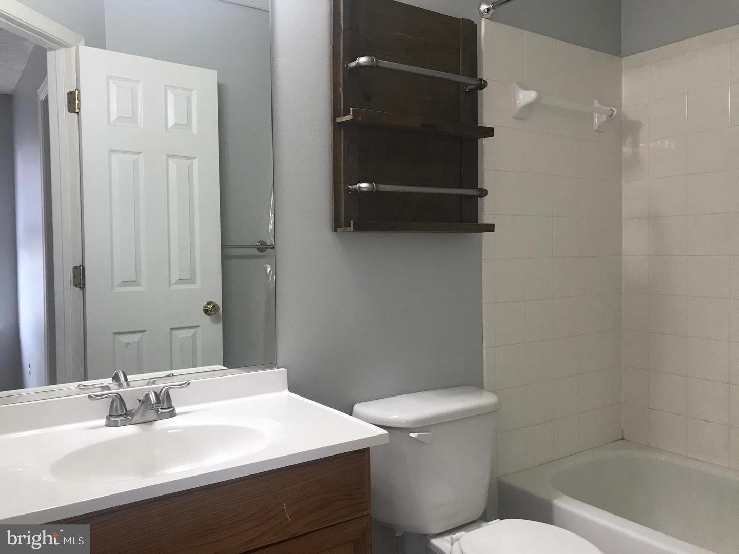 3004 Raking Leaf Drive Abingdon, MD 21009 - Photo 8 of 15 a bathroom with a sink a toilet and shower