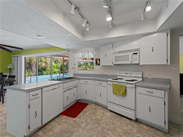 a front view of a house with a garden and yard