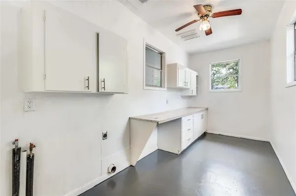 a view of cabinets and wooden floor