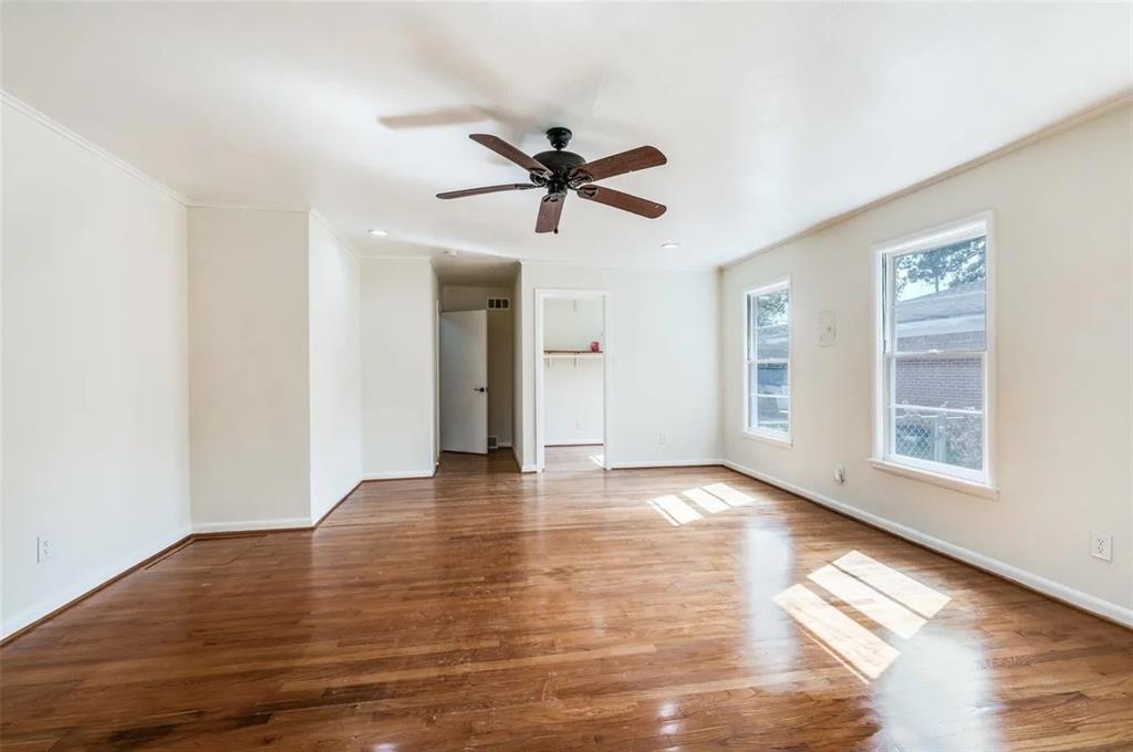 529 Roberts Cut Off Road River Oaks, TX 76114 - Photo 5 of 12 Unfurnished room featuring hardwood / wood-style flooring, ceiling fan, and crown molding