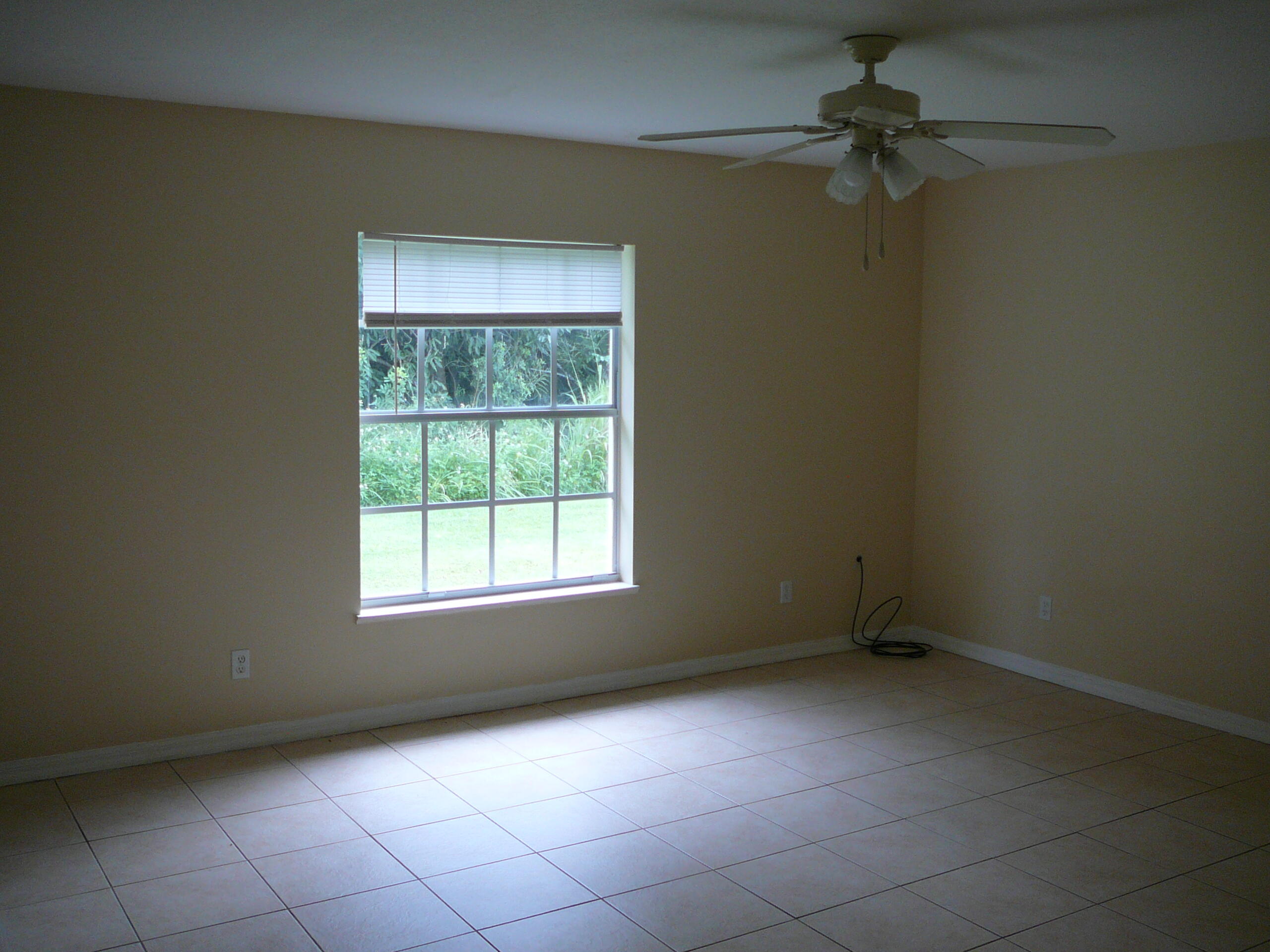 6512 Las Palmas Way Port St. Lucie, FL 34952 - Photo 21 of 45 an empty room with a window