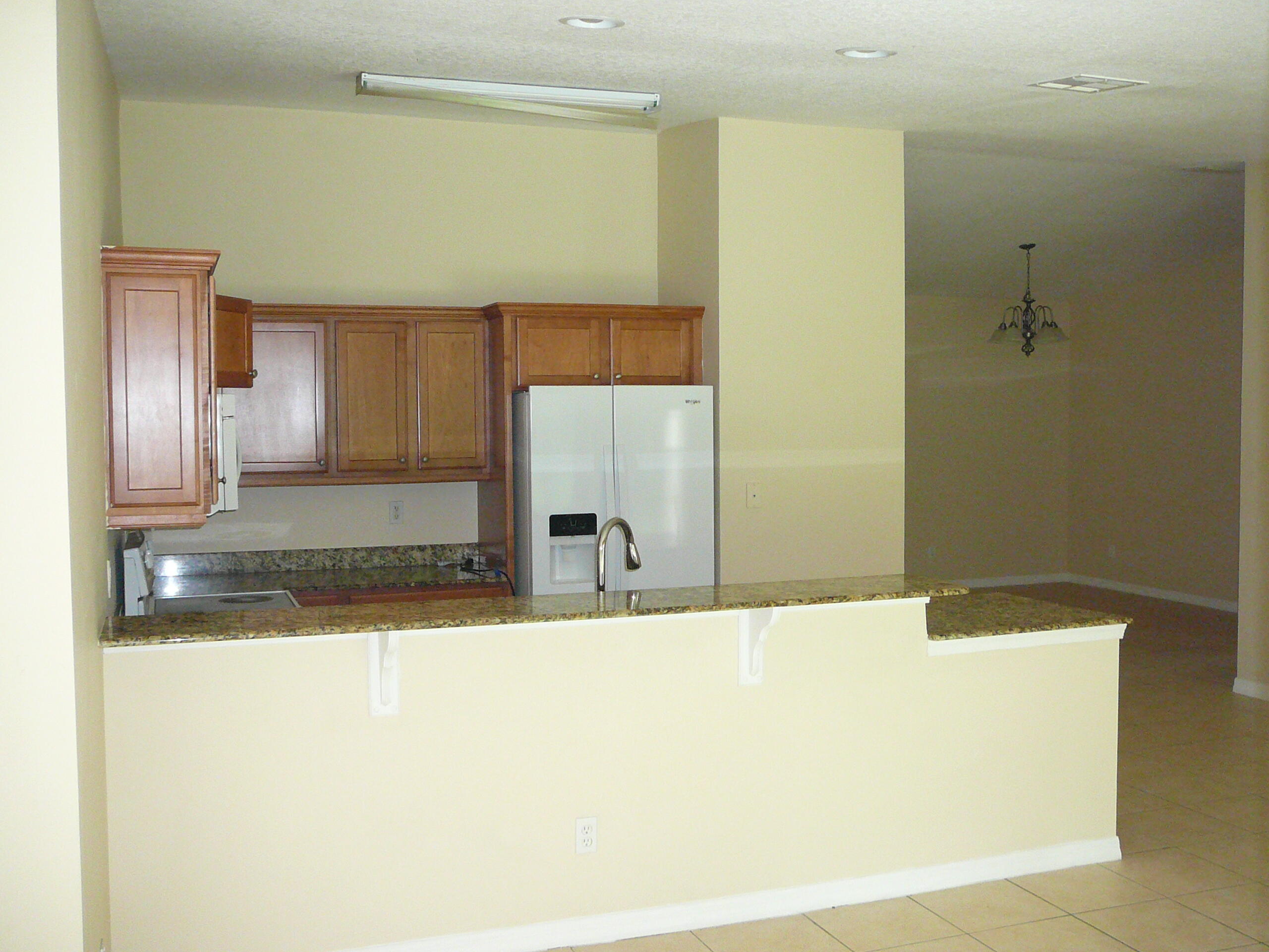 6512 Las Palmas Way Port St. Lucie, FL 34952 - Photo 23 of 45 a view of a kitchen with a sink