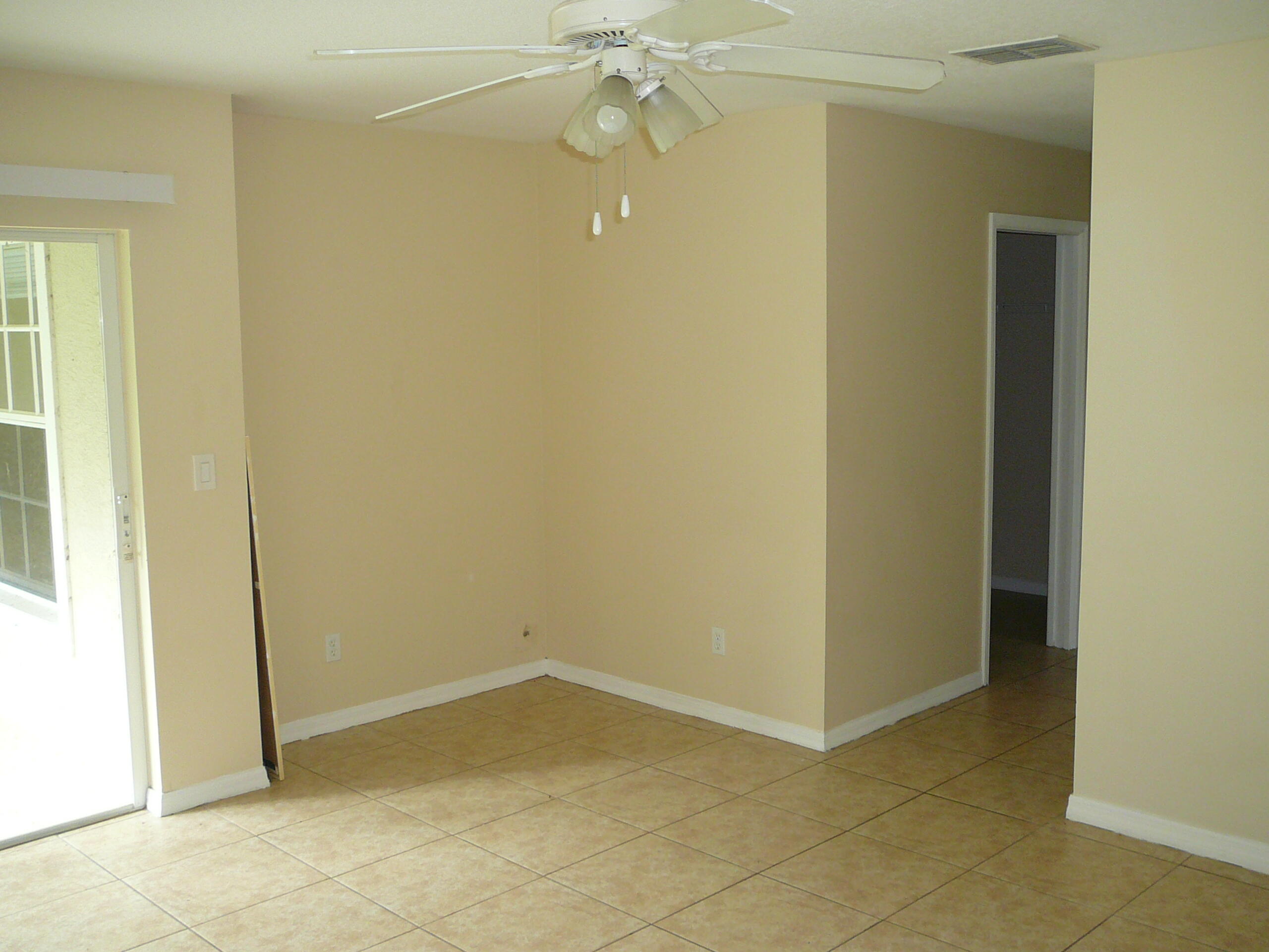 6512 Las Palmas Way Port St. Lucie, FL 34952 - Photo 31 of 45 an empty room with a fan and a window