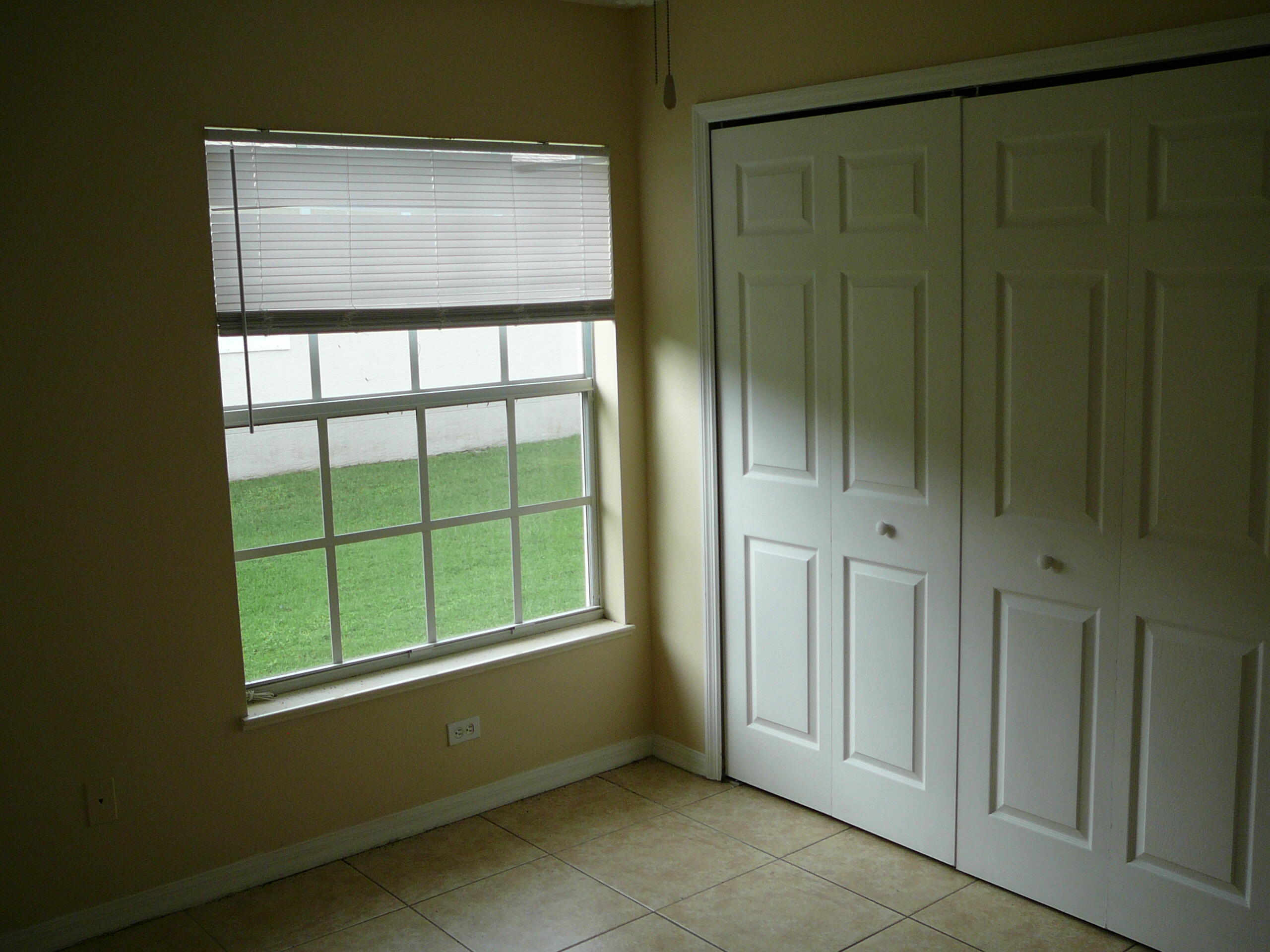 6512 Las Palmas Way Port St. Lucie, FL 34952 - Photo 36 of 45 a view of an empty room with a window