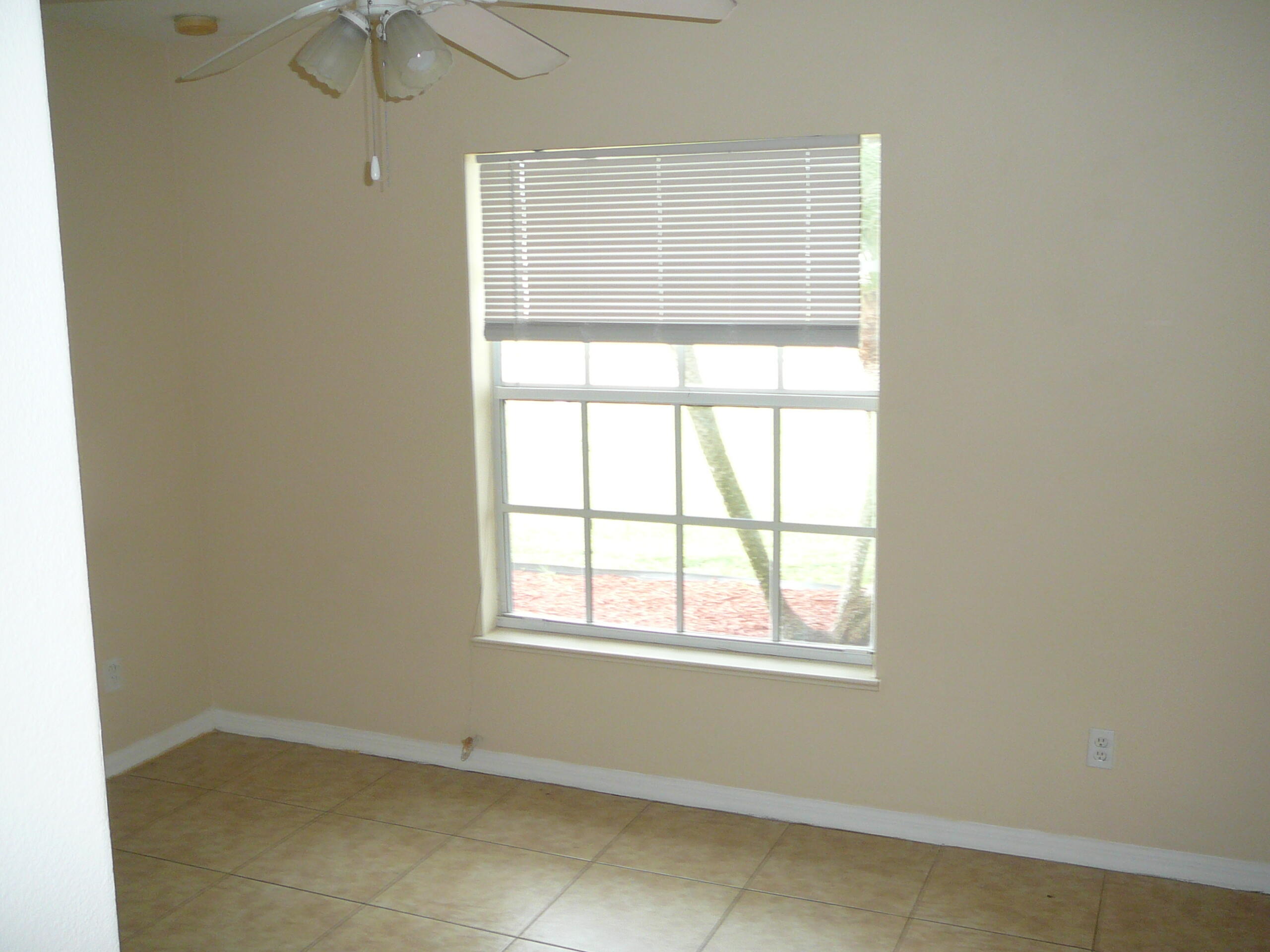 6512 Las Palmas Way Port St. Lucie, FL 34952 - Photo 39 of 45 an empty room with a window
