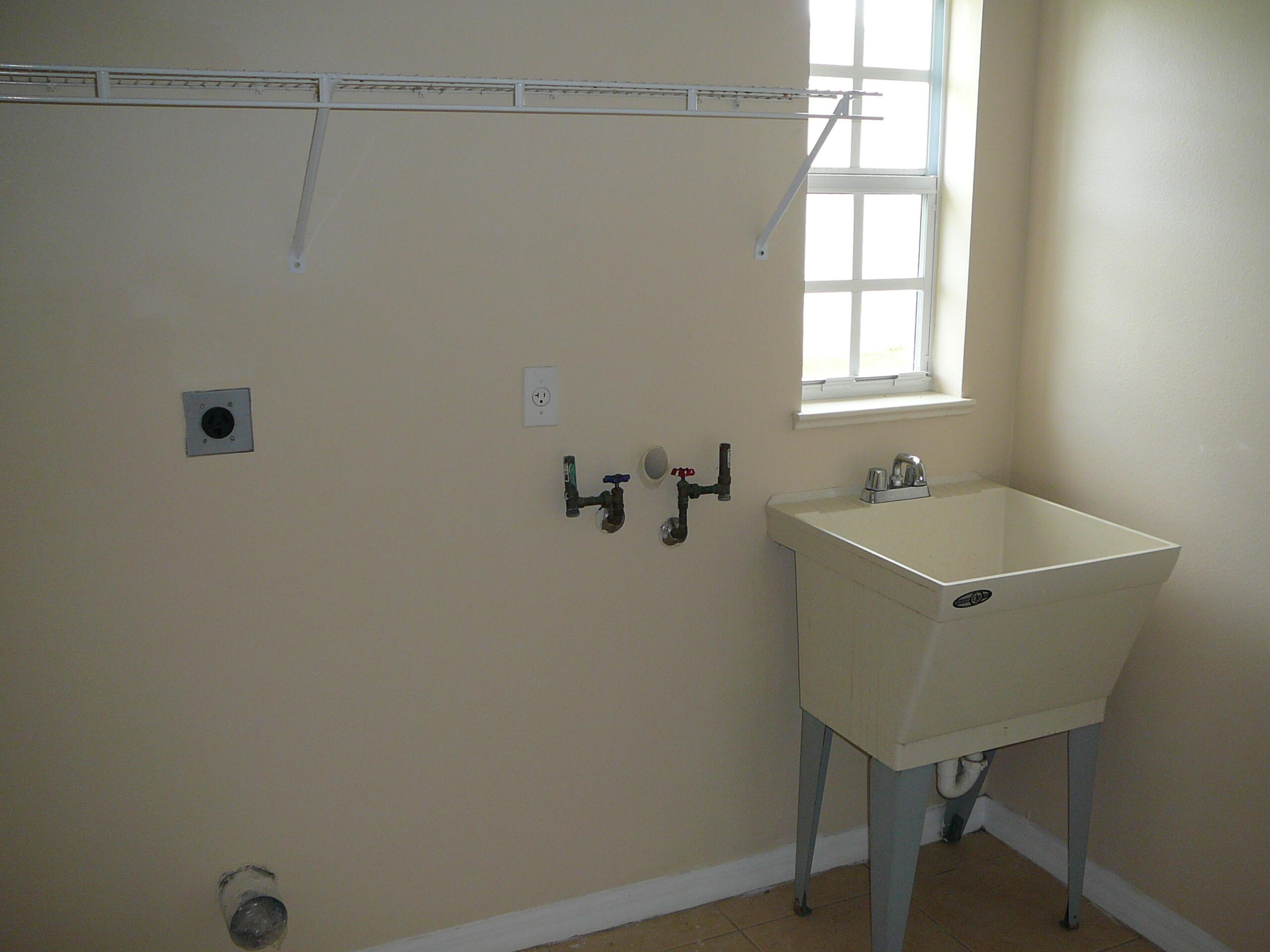 6512 Las Palmas Way Port St. Lucie, FL 34952 - Photo 42 of 45 a bathroom with a bathtub and shower