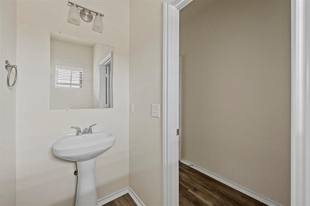 601 Thomas Street, Unit 1 Bonham, TX 75418 - Photo 16 of 23 a bathroom with a sink and a mirror