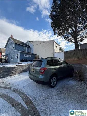 a car parked in front of a house