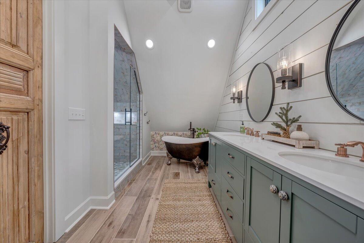 3851 Joppa Mill Road Moneta, VA 24121 - Photo 77 of 104 a spacious bathroom with a double vanity sink and a mirror