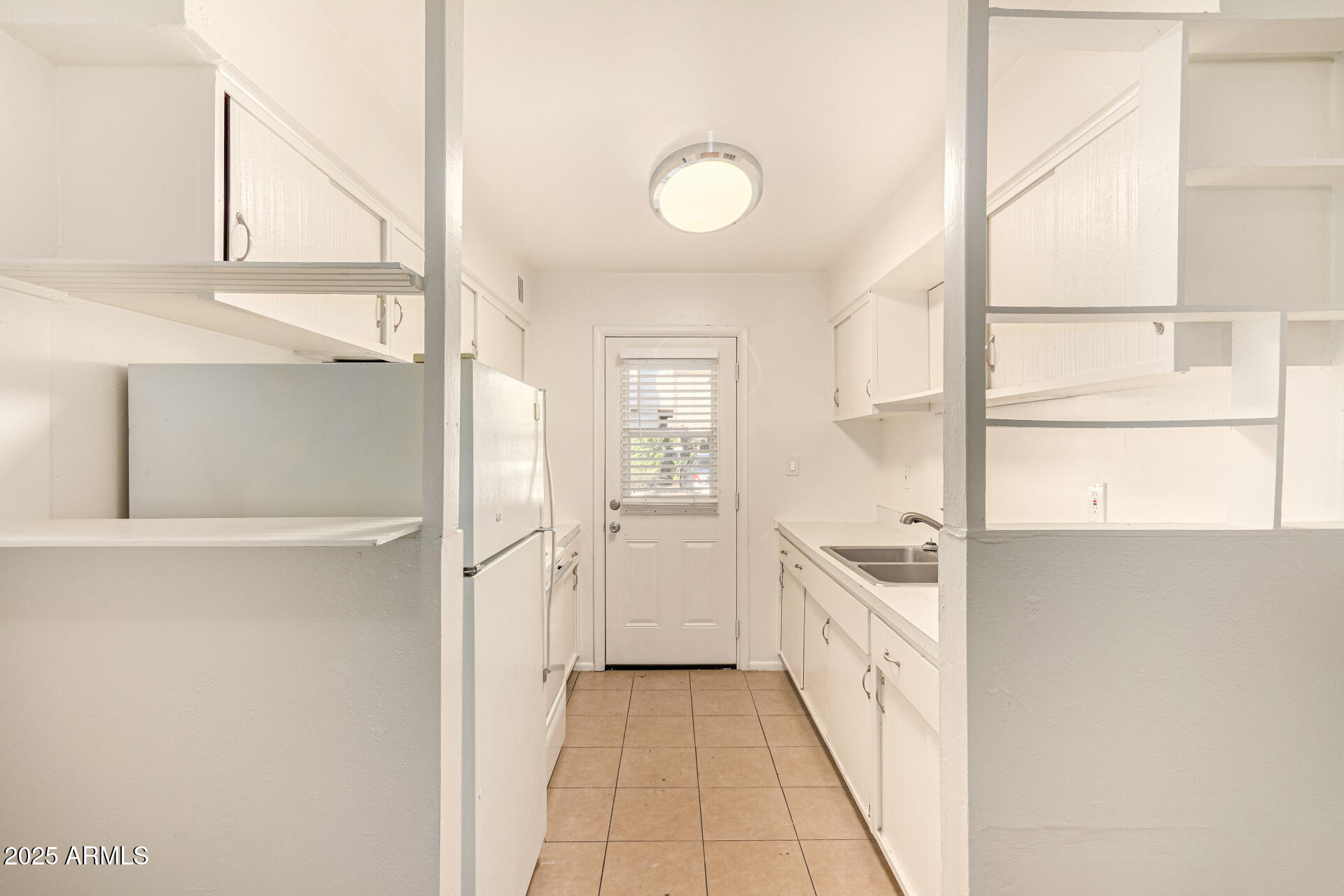1204 West 5th Street, Unit 8 Tempe, AZ 85281 - Photo 6 of 18 a kitchen with white cabinets and a sink
