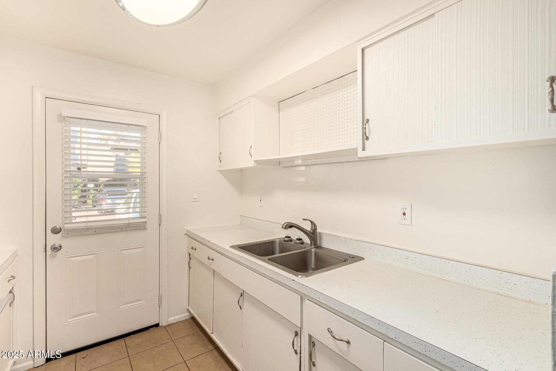 1204 West 5th Street, Unit 8 Tempe, AZ 85281 - Photo 7 of 18 a kitchen with a sink and cabinets
