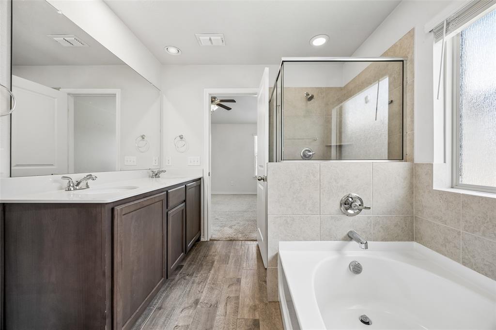 3807 Dogwood Road Melissa, TX 75454 - Photo 26 of 38 a bathroom with a tub sink and mirror