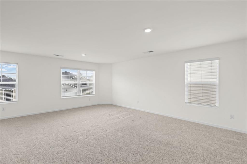 166 Champlain Road Hoschton, GA 30548 - Photo 27 of 53 an empty room with windows