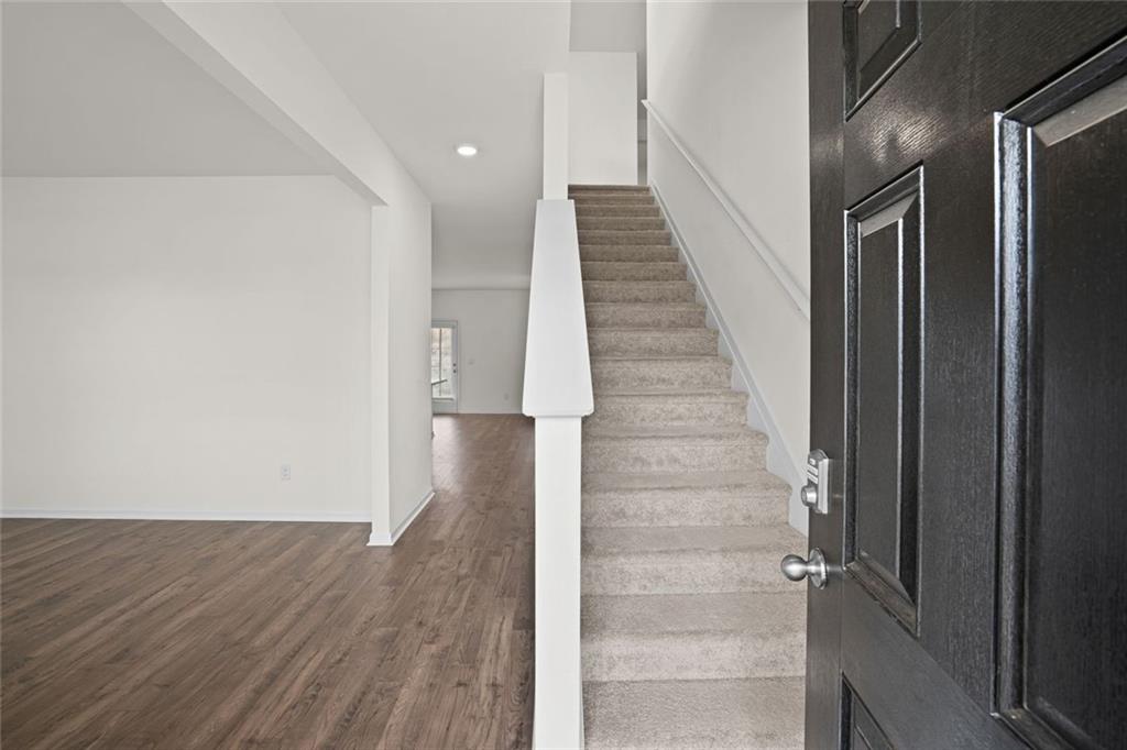 166 Champlain Road Hoschton, GA 30548 - Photo 3 of 53 a view of an entryway with wooden floor