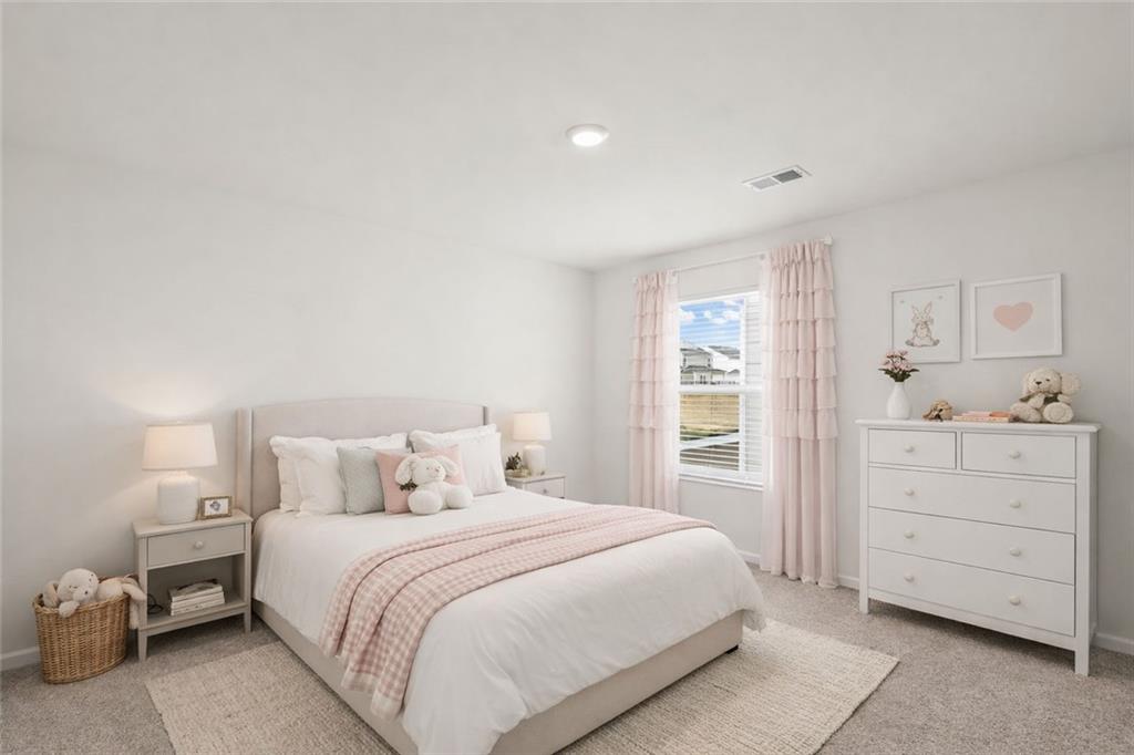 166 Champlain Road Hoschton, GA 30548 - Photo 33 of 53 a bedroom with a bed and a window