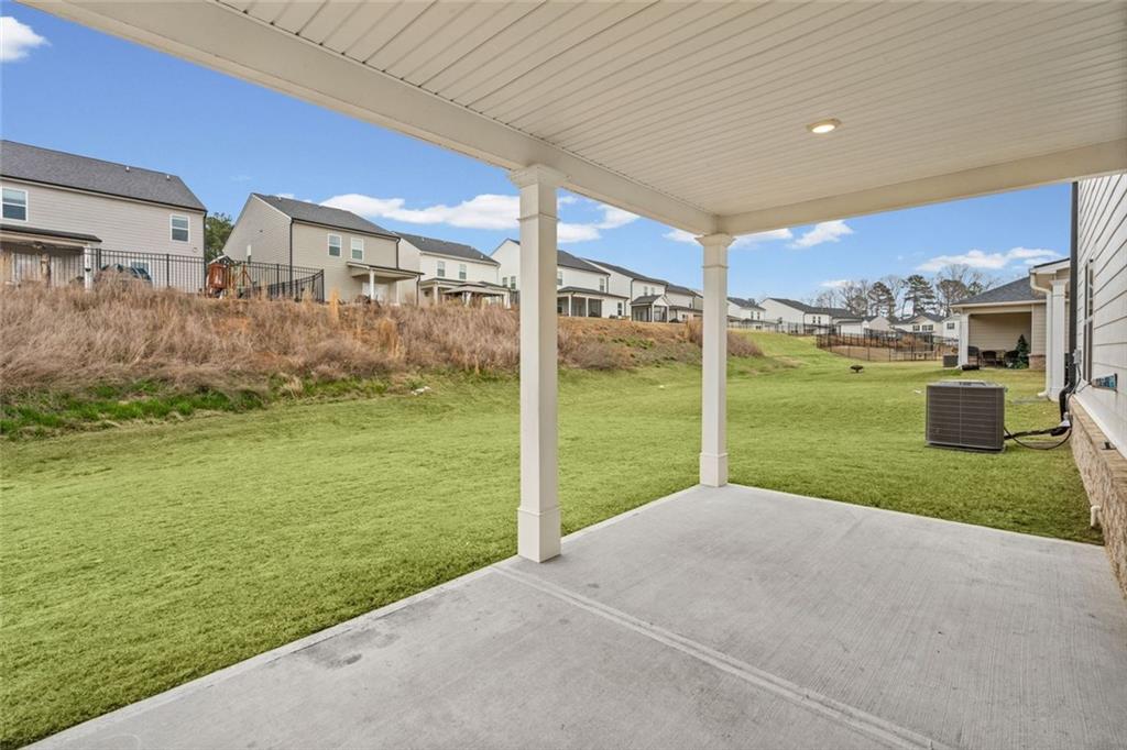166 Champlain Road Hoschton, GA 30548 - Photo 40 of 53 a view of a house with yard and a garden