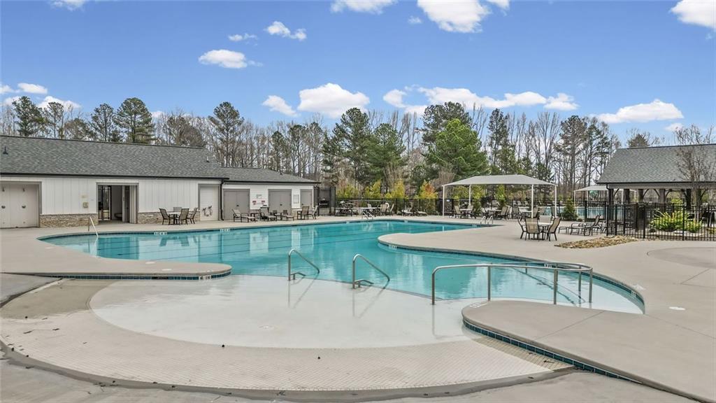166 Champlain Road Hoschton, GA 30548 - Photo 44 of 53 a view of a house with a yard