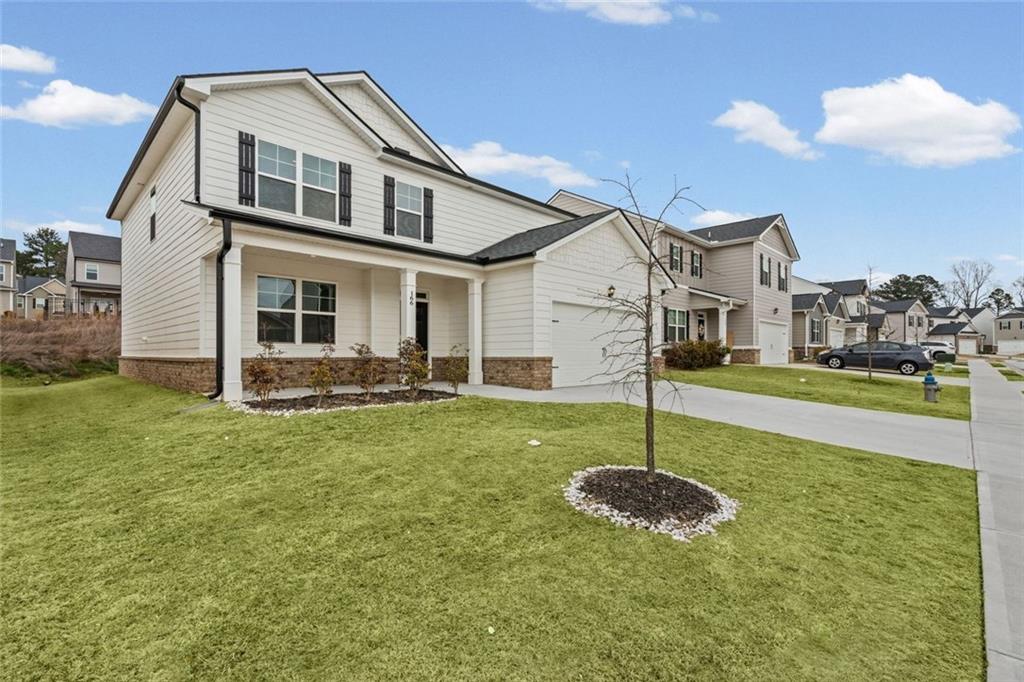 166 Champlain Road Hoschton, GA 30548 - Photo 53 of 53 a house view with a garden space