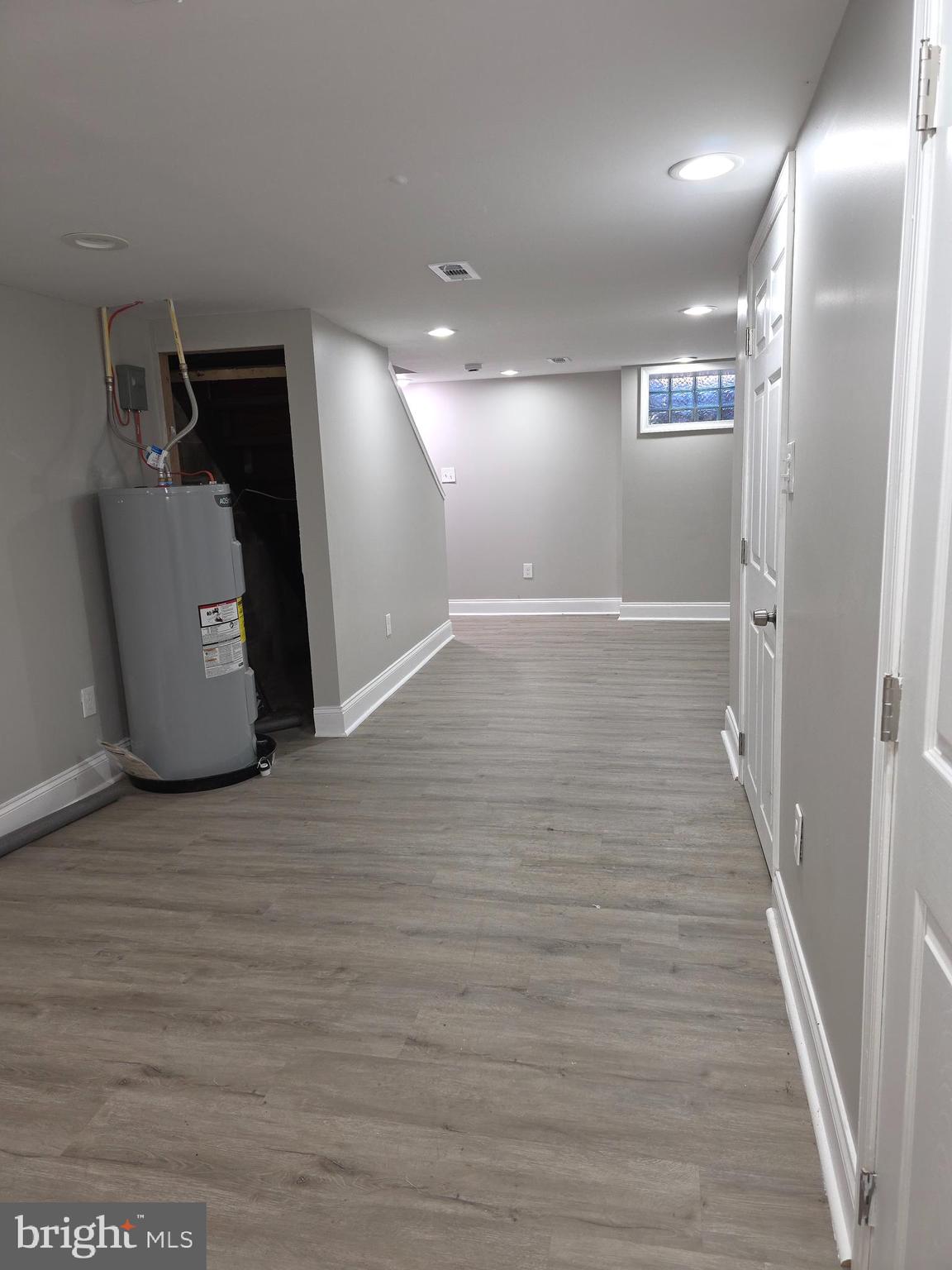 1042 Ellicott Driveway Baltimore, MD 21216 - Photo 11 of 13 a view of a hallway with wooden floor