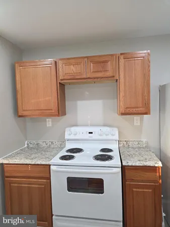 a kitchen with a stove and a microwave