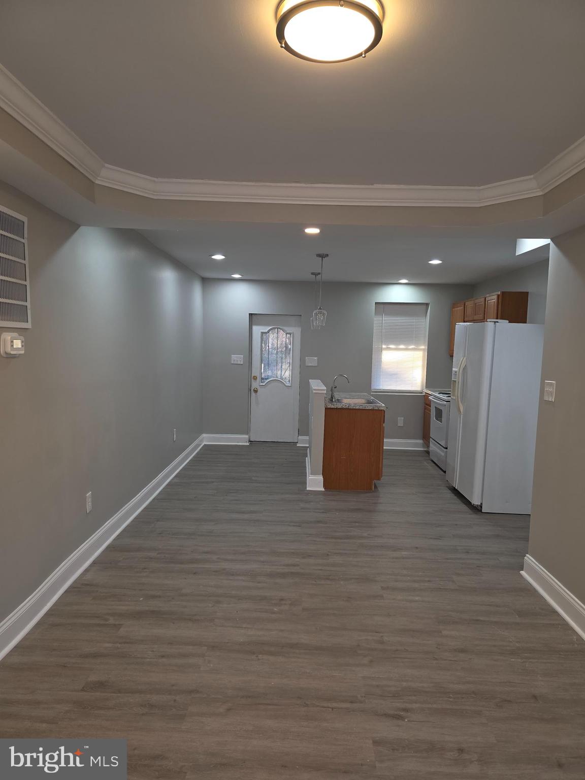 1042 Ellicott Driveway Baltimore, MD 21216 - Photo 6 of 13 a view of a livingroom with furniture nad wooden floor
