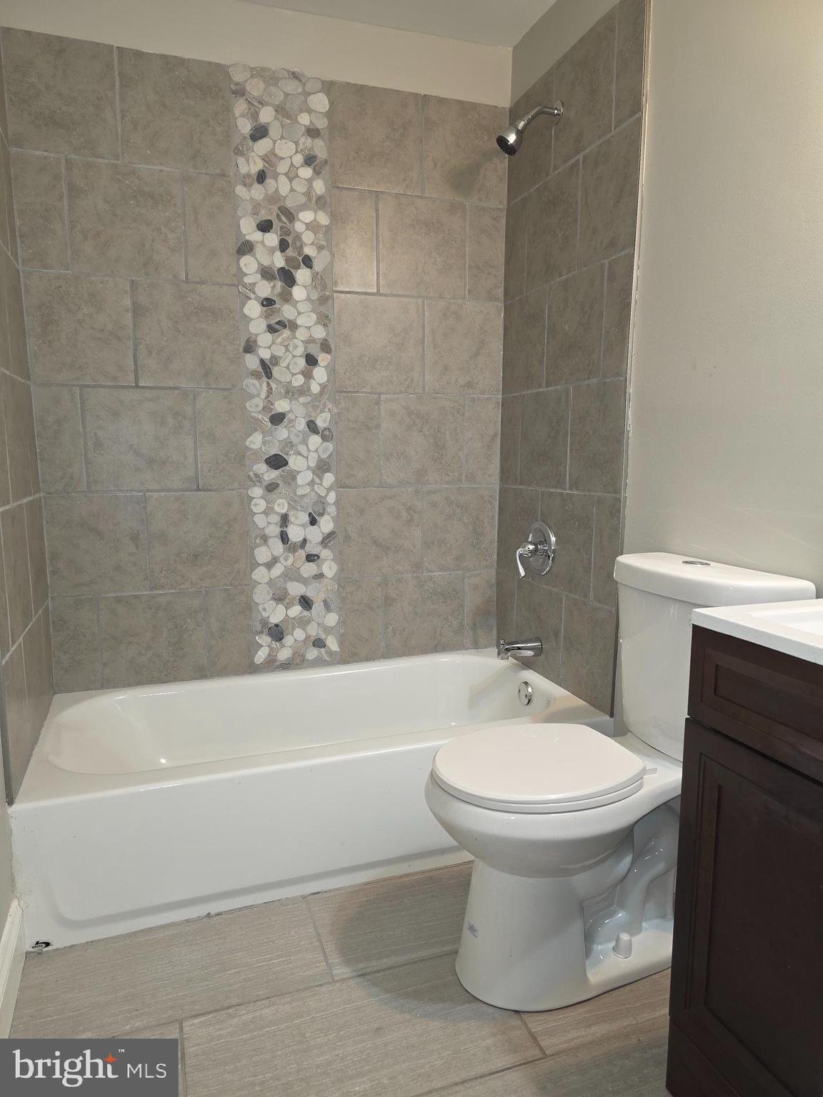 1042 Ellicott Driveway Baltimore, MD 21216 - Photo 7 of 13 a bathroom with a white toilet and sink