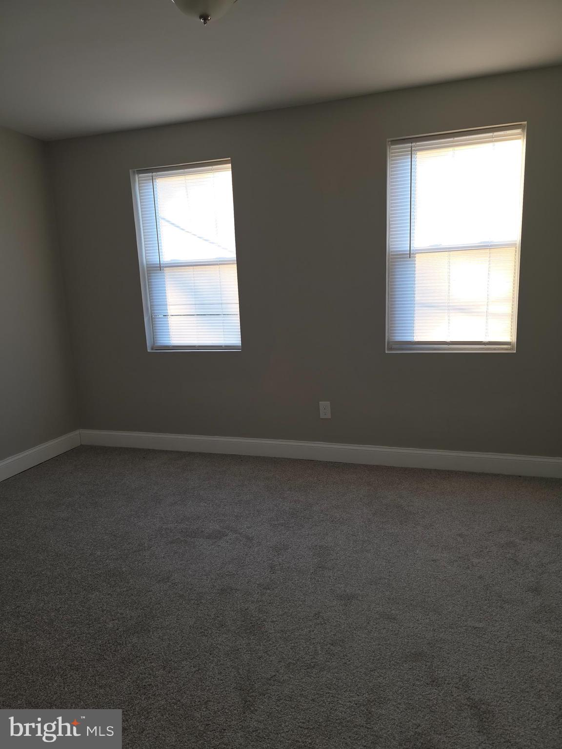 1042 Ellicott Driveway Baltimore, MD 21216 - Photo 8 of 13 an empty room with a window