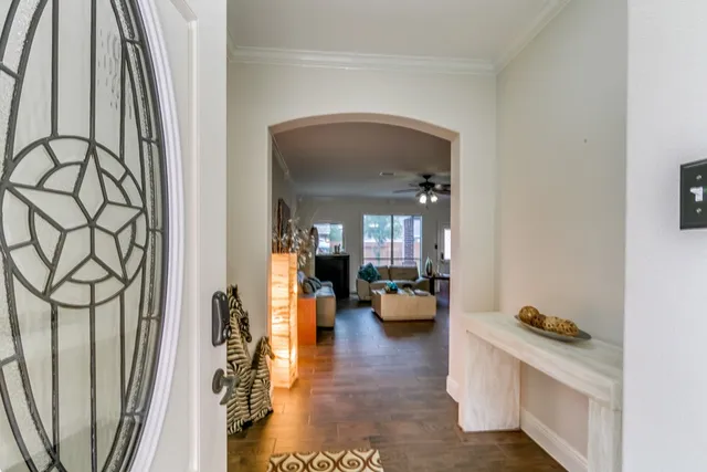 a view of living room with furniture and wooden floor