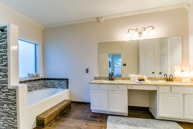 a kitchen with a sink stove and cabinets