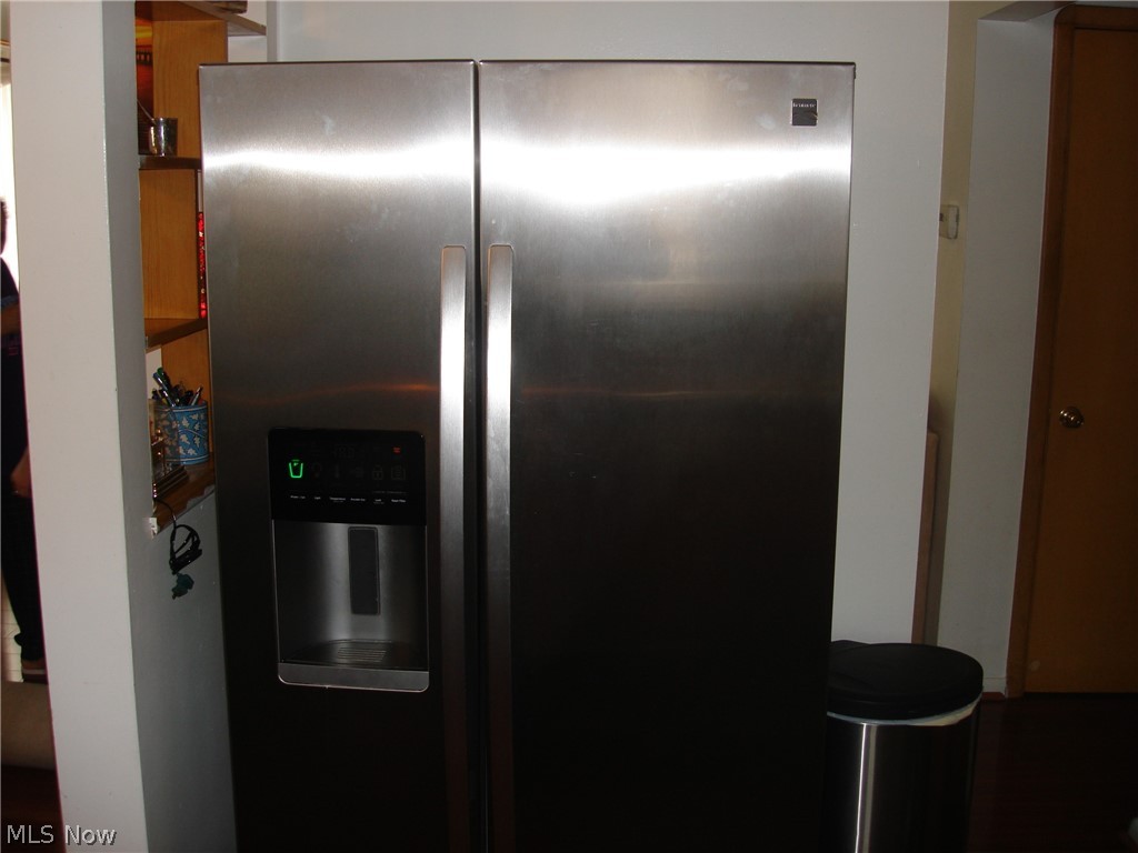 7164 Maplewood Road Parma, OH 44130 - Photo 8 of 13 NEWER STAINLESS STEEL DOUBLE DOOR REFRIGERATOR TO STAY.